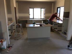 Man Working On Kitchen Renovation — Renovation In Townsville
